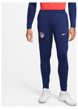 Męskie dzianinowe spodnie piłkarskie Atlético Madryt Strike Nike Dri-FIT - Niebieski ze sklepu Nike poland w kategorii Spodnie męskie - zdjęcie 169756623
