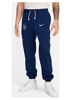 Męskie spodnie piłkarskie Nike Atlético Madryt Standard Issue - Niebieski ze sklepu Nike poland w kategorii Spodnie męskie - zdjęcie 169756923
