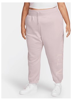 Damskie spodnie dresowe o kroju oversize z logo Nike Sportswear Phoenix Fleece (duże rozmiary) - Fiolet ze sklepu Nike poland w kategorii Spodnie damskie - zdjęcie 169757024