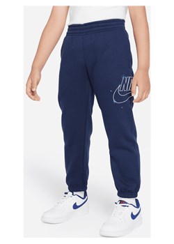 Spodnie dla małych dzieci Nike Sportswear Shine Fleece - Niebieski ze sklepu Nike poland w kategorii Spodnie chłopięce - zdjęcie 169757724