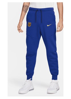 Męskie joggery piłkarskie Nike FC Barcelona Tech Fleece - Niebieski ze sklepu Nike poland w kategorii Spodnie męskie - zdjęcie 169757782