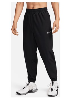 Męskie uniwersalne spodnie ze zwężanymi nogawkami Dri-FIT Nike Form - Czerń ze sklepu Nike poland w kategorii Spodnie męskie - zdjęcie 169758431