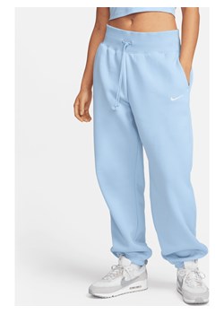 Damskie spodnie dresowe o kroju oversize z wysokim stanem Nike Sportswear Phoenix Fleece - Niebieski ze sklepu Nike poland w kategorii Spodnie damskie - zdjęcie 169758862