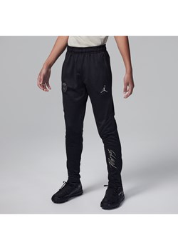 Dzianinowe spodnie piłkarskie dla dużych dzieci Jordan Dri-FIT Paris Saint-Germain Strike (wersja trzecia) - Czerń ze sklepu Nike poland w kategorii Spodnie chłopięce - zdjęcie 169758891