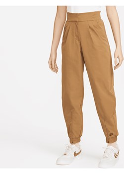 Damskie spodnie z wysokim stanem Nike Sportswear Dri-FIT Tech Pack - Brązowy ze sklepu Nike poland w kategorii Spodnie damskie - zdjęcie 169758944