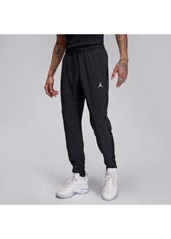 Męskie spodnie z tkaniny Dri-FIT Jordan Sport - Czerń ze sklepu Nike poland w kategorii Spodnie męskie - zdjęcie 169759084