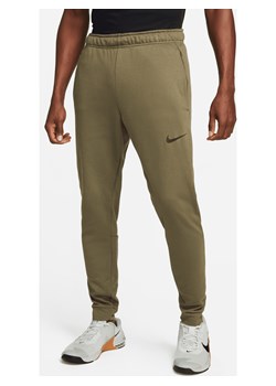 Męskie zwężane spodnie do fitnessu z dzianiny Dri-FIT Nike Dry - Zieleń ze sklepu Nike poland w kategorii Spodnie męskie - zdjęcie 169759311