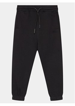 OVS Spodnie dresowe 1964985 Czarny Regular Fit ze sklepu MODIVO w kategorii Spodnie chłopięce - zdjęcie 169800504