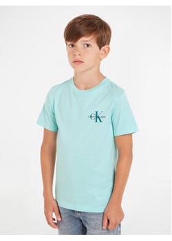 Calvin Klein Jeans T-Shirt Monogram IB0IB01231 D Niebieski Regular Fit ze sklepu MODIVO w kategorii T-shirty chłopięce - zdjęcie 169844142