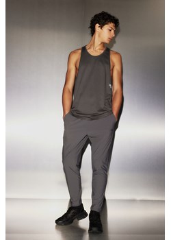 H & M - Spodnie z czterokierunkowym stretchem DryMove - Szary ze sklepu H&M w kategorii Spodnie męskie - zdjęcie 169871810