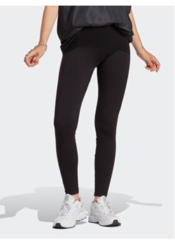 adidas Legginsy Adicolor Essentials Leggings IA6446 Czarny Slim Fit ze sklepu MODIVO w kategorii Spodnie damskie - zdjęcie 169896101