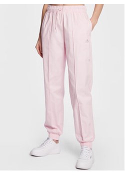 adidas Spodnie dresowe Loose Trousers with Healing Crystals-Inspired Graphics IC0795 Różowy Loose Fit ze sklepu MODIVO w kategorii Spodnie damskie - zdjęcie 169995734