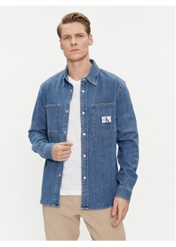 Calvin Klein Jeans Koszula jeansowa Linear J30J324885 Niebieski Slim Fit ze sklepu MODIVO w kategorii Koszule męskie - zdjęcie 170009291