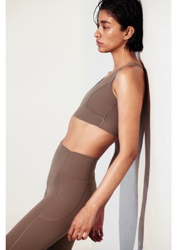 H & M - Sportowe legginsy ShapeMove z kieszonką - Beżowy ze sklepu H&M w kategorii Spodnie ciążowe - zdjęcie 170040512