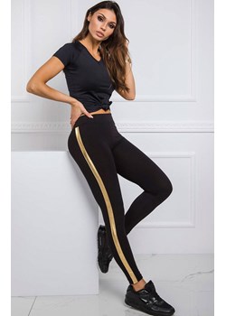 Legginsy damskie czarne z złotym lampasem RV-LG-R4766.06, Kolor czarno-złoty, Rozmiar XL, Rue Paris ze sklepu Primodo w kategorii Spodnie damskie - zdjęcie 170104464