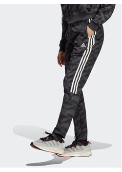adidas Spodnie dresowe Tiro Suit Up Lifestyle Track Pant IC6655 Szary Regular Fit ze sklepu MODIVO w kategorii Spodnie damskie - zdjęcie 170149282