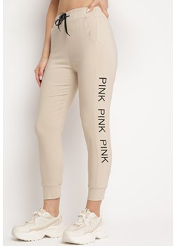 Beżowe Spodnie Bawełniane z Ozdobnymi Napisami Wyższy Stan Storja ze sklepu Born2be Odzież w kategorii Spodnie damskie - zdjęcie 170154063