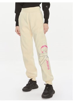 Calvin Klein Jeans Spodnie dresowe Bold Monologo J20J222606 Żółty Relaxed Fit ze sklepu MODIVO w kategorii Spodnie damskie - zdjęcie 170238213