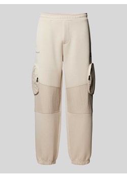 Spodnie dresowe o luźnym kroju z kieszeniami cargo model ‘PANTALONI’ ze sklepu Peek&Cloppenburg  w kategorii Spodnie męskie - zdjęcie 170409444