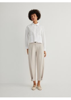 Reserved - Spodnie z zapięciem na nogawkach - kremowy ze sklepu Reserved w kategorii Spodnie damskie - zdjęcie 170447271