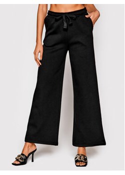 NA-KD Spodnie dresowe 1100-005464-0002-003 Czarny Regular Fit ze sklepu MODIVO w kategorii Spodnie damskie - zdjęcie 170468143