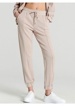 Sinsay - Spodnie dresowe - kremowy ze sklepu Sinsay w kategorii Spodnie damskie - zdjęcie 170477520
