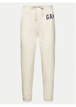Gap Spodnie dresowe 463492-12 Beżowy Regular Fit ze sklepu MODIVO w kategorii Spodnie damskie - zdjęcie 170525902