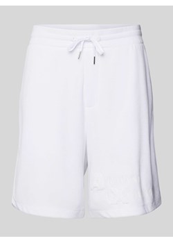 Szorty z dzianiny dresowej o kroju regular fit z nadrukiem z logo ze sklepu Peek&Cloppenburg  w kategorii Spodenki męskie - zdjęcie 170529993