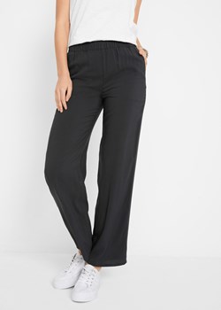 Spodnie z wiskozy  z wygodnym paskiem i szerokimi nogawkami ze sklepu bonprix w kategorii Spodnie damskie - zdjęcie 170593340