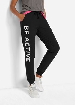 Spodnie sportowe bawełniane z nadrukiem, Loose Fit ze sklepu bonprix w kategorii Spodnie damskie - zdjęcie 170596780