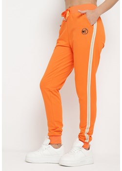 Pomarańczowe Spodnie Dresowe z Ozdobnym Lampasem Adiska ze sklepu Born2be Odzież w kategorii Spodnie damskie - zdjęcie 170646773