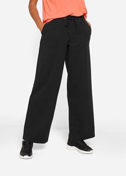 Spodnie sportowe bawełniane, szerokie nogawki ze sklepu bonprix w kategorii Spodnie damskie - zdjęcie 170650192