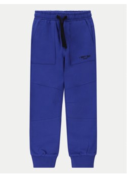 Coccodrillo Spodnie dresowe WC4120103GBK Niebieski Slim Fit ze sklepu MODIVO w kategorii Spodnie chłopięce - zdjęcie 170659673