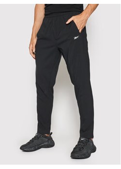Reebok Spodnie dresowe Workout Ready FJ4060 Czarny Slim Fit ze sklepu MODIVO w kategorii Spodnie męskie - zdjęcie 170659760