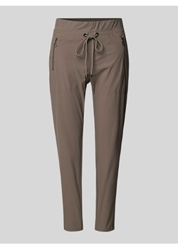 Spodnie o kroju tapered fit z kieszeniami zapinanymi na zamek błyskawiczny model ‘EASY ACTIVE’ ze sklepu Peek&Cloppenburg  w kategorii Spodnie damskie - zdjęcie 170778670