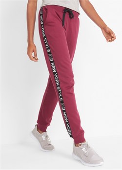 Spodnie dresowe ze ściągaczem i napisem ze sklepu bonprix w kategorii Spodnie damskie - zdjęcie 170793860