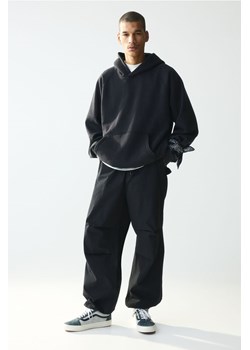 H & M - Spodnie spadochronowe Loose Fit - Czarny ze sklepu H&M w kategorii Spodnie męskie - zdjęcie 170809930