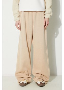 adidas Originals spodnie dresowe bawełniane Essentials+ kolor beżowy gładkie IR6017 ze sklepu PRM w kategorii Spodnie damskie - zdjęcie 170874580