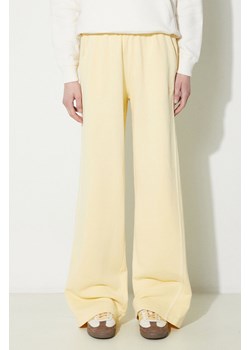 adidas Originals spodnie dresowe bawełniane Essentials+ kolor żółty gładkie IR6020 ze sklepu PRM w kategorii Spodnie damskie - zdjęcie 170874582