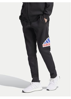 adidas Spodnie dresowe Future Icons Badge of Sport IS3232 Czarny Regular Fit ze sklepu MODIVO w kategorii Spodnie męskie - zdjęcie 170918234