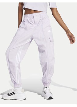 adidas Spodnie dresowe Dance All-Gender Versatile IS0907 Fioletowy Loose Fit ze sklepu MODIVO w kategorii Spodnie damskie - zdjęcie 170919243