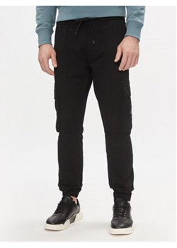 Calvin Klein Jeans Spodnie dresowe J30J324696 Czarny Skinny Fit ze sklepu MODIVO w kategorii Spodnie męskie - zdjęcie 170951714