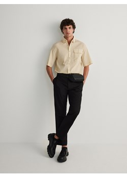 Reserved - Spodnie chino leisure fit - czarny ze sklepu Reserved w kategorii Spodnie męskie - zdjęcie 170977003