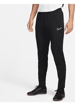 Męskie dzianinowe spodnie piłkarskie Nike Therma Fit Academy Winter Warrior - Czerń ze sklepu Nike poland w kategorii Spodnie męskie - zdjęcie 170993420