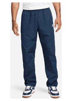 Męskie bojówki z tkaniny Nike Club - Niebieski ze sklepu Nike poland w kategorii Spodnie męskie - zdjęcie 170993432