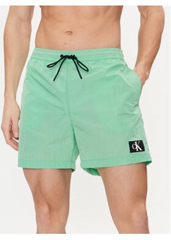 Calvin Klein Swimwear Szorty kąpielowe KM0KM00980 Zielony Regular Fit ze sklepu MODIVO w kategorii Kąpielówki - zdjęcie 171007010