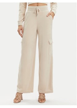 Juicy Couture Spodnie dresowe Audree JCWBJ23334 Beżowy Loose Fit ze sklepu MODIVO w kategorii Spodnie damskie - zdjęcie 171036891