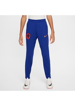 Dzianinowe spodnie piłkarskie dla dużych dzieci Nike Dri-FIT Holandia Strike - Niebieski ze sklepu Nike poland w kategorii Spodnie chłopięce - zdjęcie 171206781