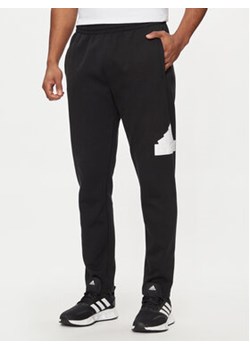 adidas Spodnie dresowe Future Icons IN3322 Czarny Regular Fit ze sklepu MODIVO w kategorii Spodnie męskie - zdjęcie 171212641
