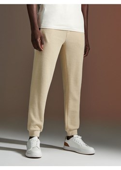 Sinsay - Spodnie dresowe - kremowy ze sklepu Sinsay w kategorii Spodnie męskie - zdjęcie 171322822